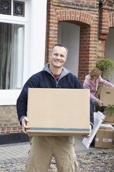 Removal team preparing a home move in Harlington with furniture and boxes