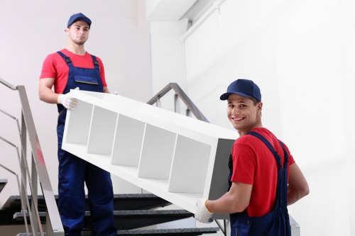 Careful loading of household furniture for transport in Harlington