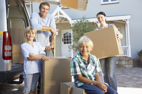 Professional movers loading items for a Harlington relocation
