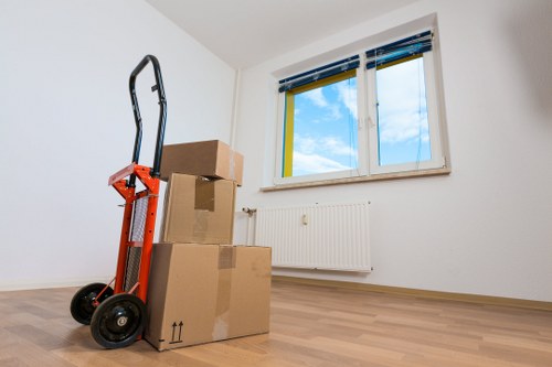 Packed boxes and dismantled furniture ready for a Harlington flat move