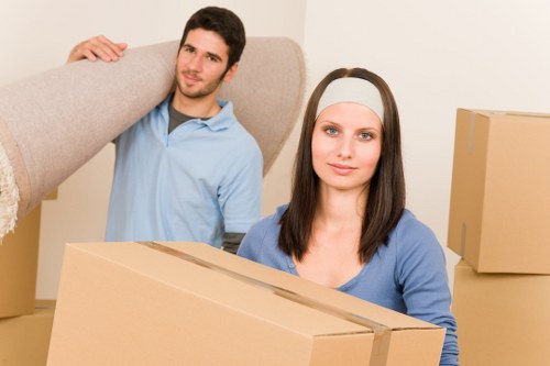 A removals team handling access challenges on a Harlington property