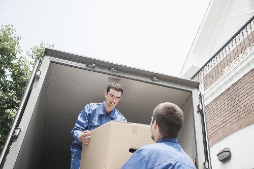 Professional moving van loading boxes and furniture for a Harlington move