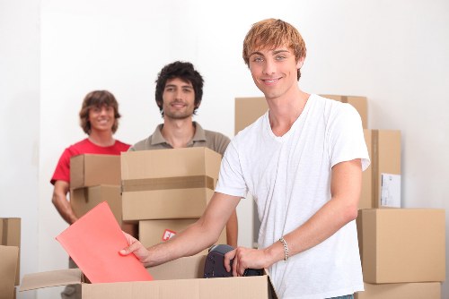 Local packing team preparing fragile belongings for a move in Harlington