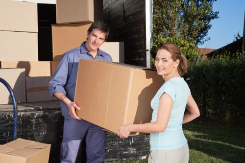 Local movers handling furniture and boxes with care